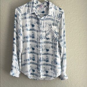 Long sleeve white button down collared shirt with faded blue print  and pocket
